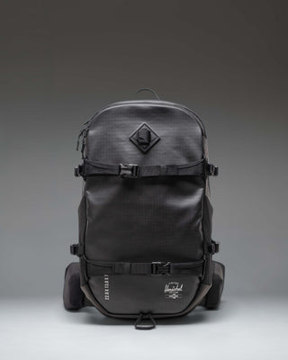 Black Herschel Supply Co. All Season Pro Backpack 36L shown from the front, highlighting its clean, functional design.