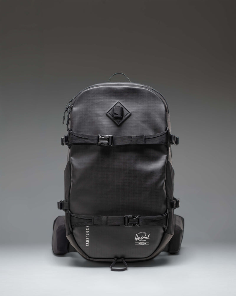 Black Herschel Supply Co. All Season Pro Backpack 36L shown from the front, highlighting its clean, functional design.