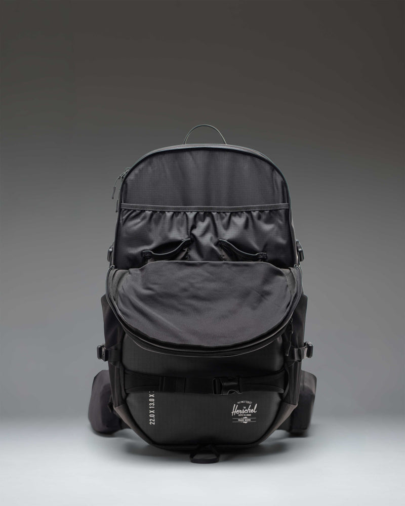 Herschel Supply Co. All Season Pro Backpack 36L in black, showcasing its technical design and multi-purpose utility straps.