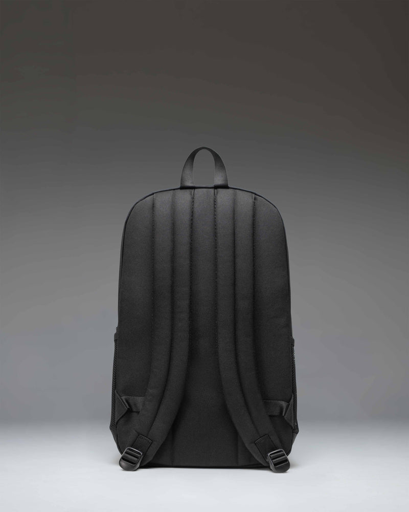 Herschel Supply Co. Fleet Skate Backpack in black, featuring front skateboard straps, signature diamond detail, and dual mesh water bottle pockets.