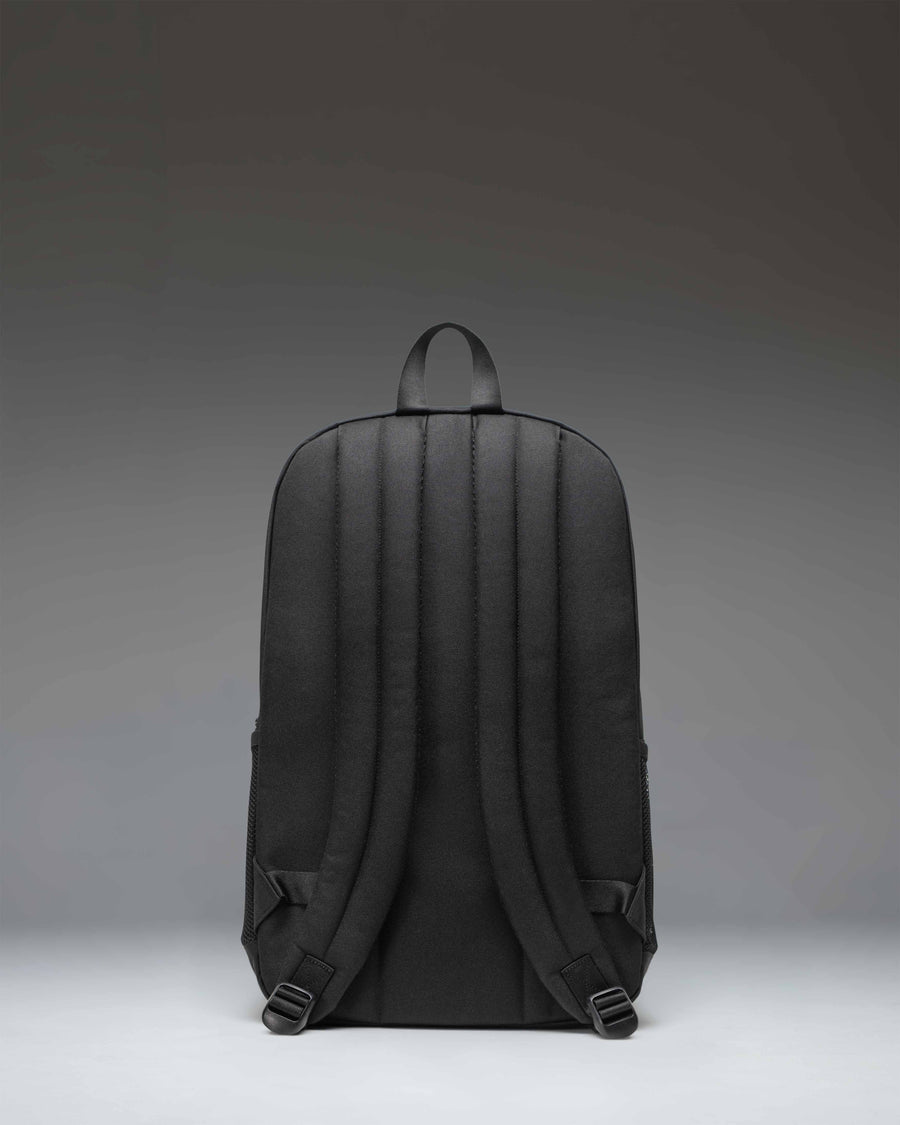 Herschel Supply Co. Fleet Skate Backpack in black, featuring front skateboard straps, signature diamond detail, and dual mesh water bottle pockets.
