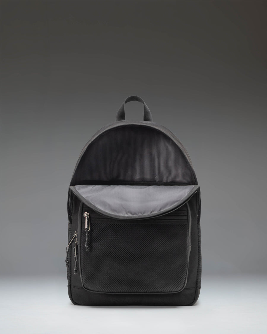 Herschel Supply Co. Kaine Backpack in solid black featuring dual water bottle pockets, a front storage pocket, and adjustable shoulder straps.
