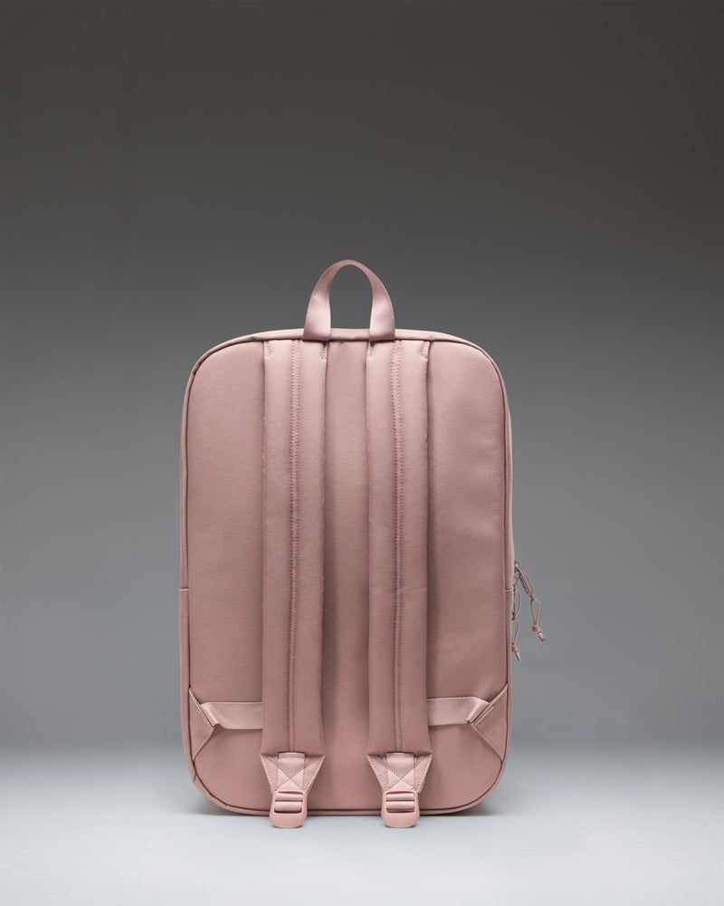 Minimalist Herschel Supply Co. Wesbrook Backpack in Ash Rose featuring a zippered front pocket and a spacious main compartment.
