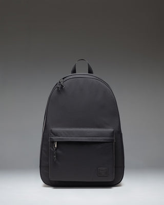 Front view of the Herschel Classic XL Backpack in black, featuring a zippered main compartment and front pocket with the signature woven label.