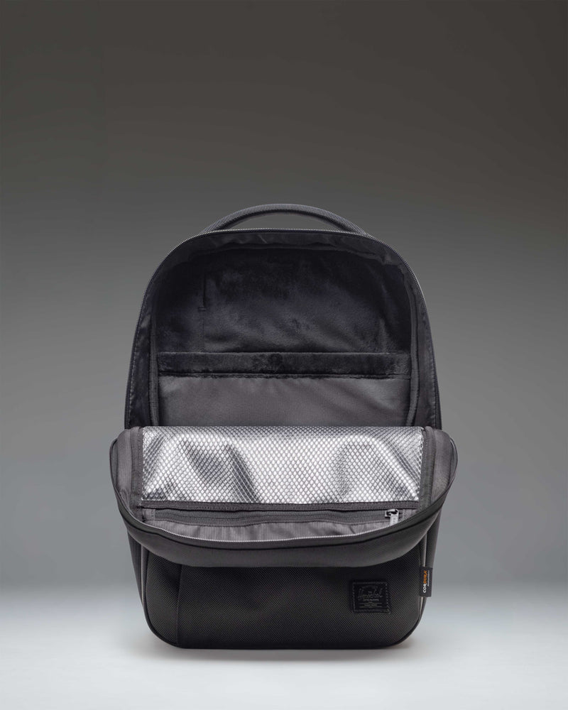 Herschel Supply Co. Kaslo Daypack Tech Cordura in black, featuring a clean, rectangular design with multiple compartments for tech storage.
