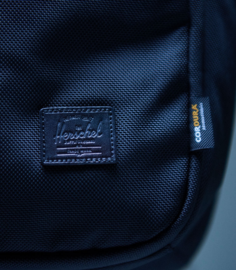 Herschel Supply Co. Kaslo Backpack Tech Cordura black backpack shown in a detailed close-up shot focusing on its premium technical features.