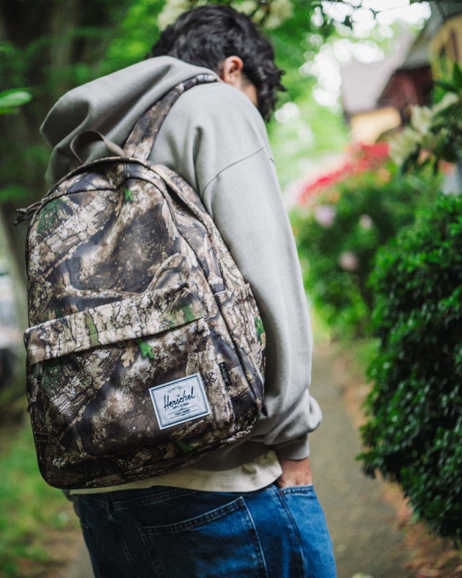 Herschel Classic XL Backpack size guide chart. Dimensions: 17.75" H x 12.75" W x 6.50" D. Capacity: 30.0L. Laptop sleeve: 12" H x 11" W.