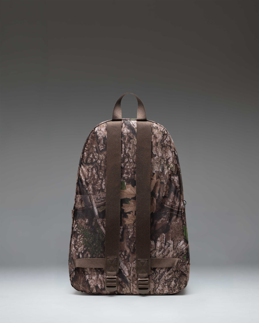 Herschel Supply Co. Realtree Rome Packable Backpack in Realtree APX Camo, showcasing the compact, lightweight design of the unfolded bag.