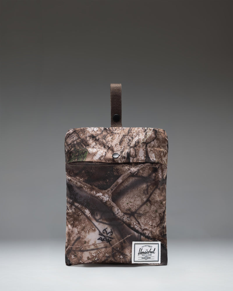 Herschel Supply Co. Realtree Rome Packable Backpack in the Realtree APX camouflage pattern.