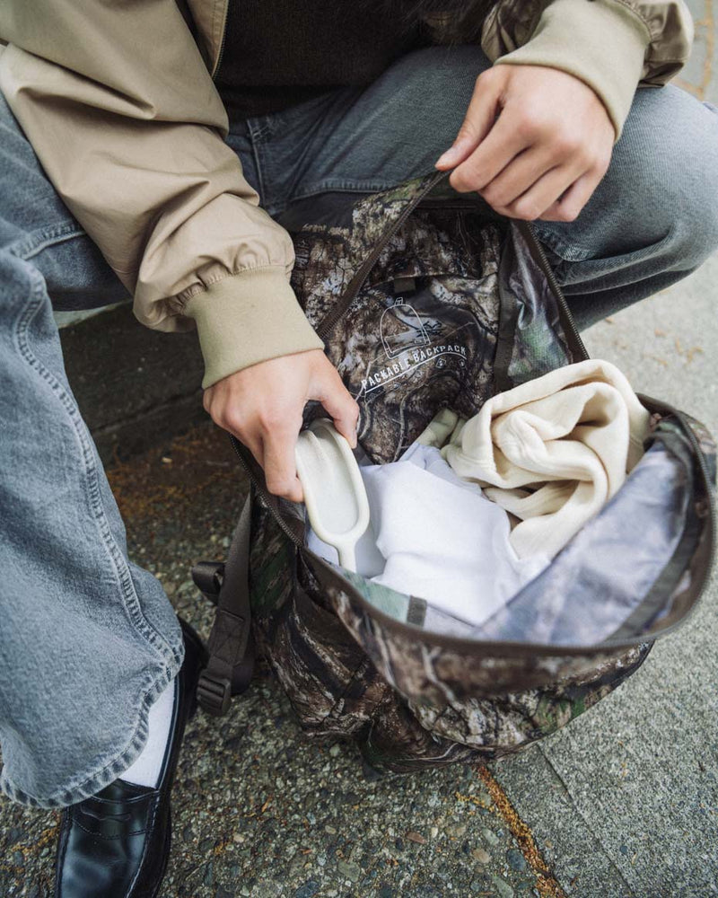 Herschel Supply Co. Realtree Rome Packable Backpack showcasing a lightweight packable design in camouflage pattern.