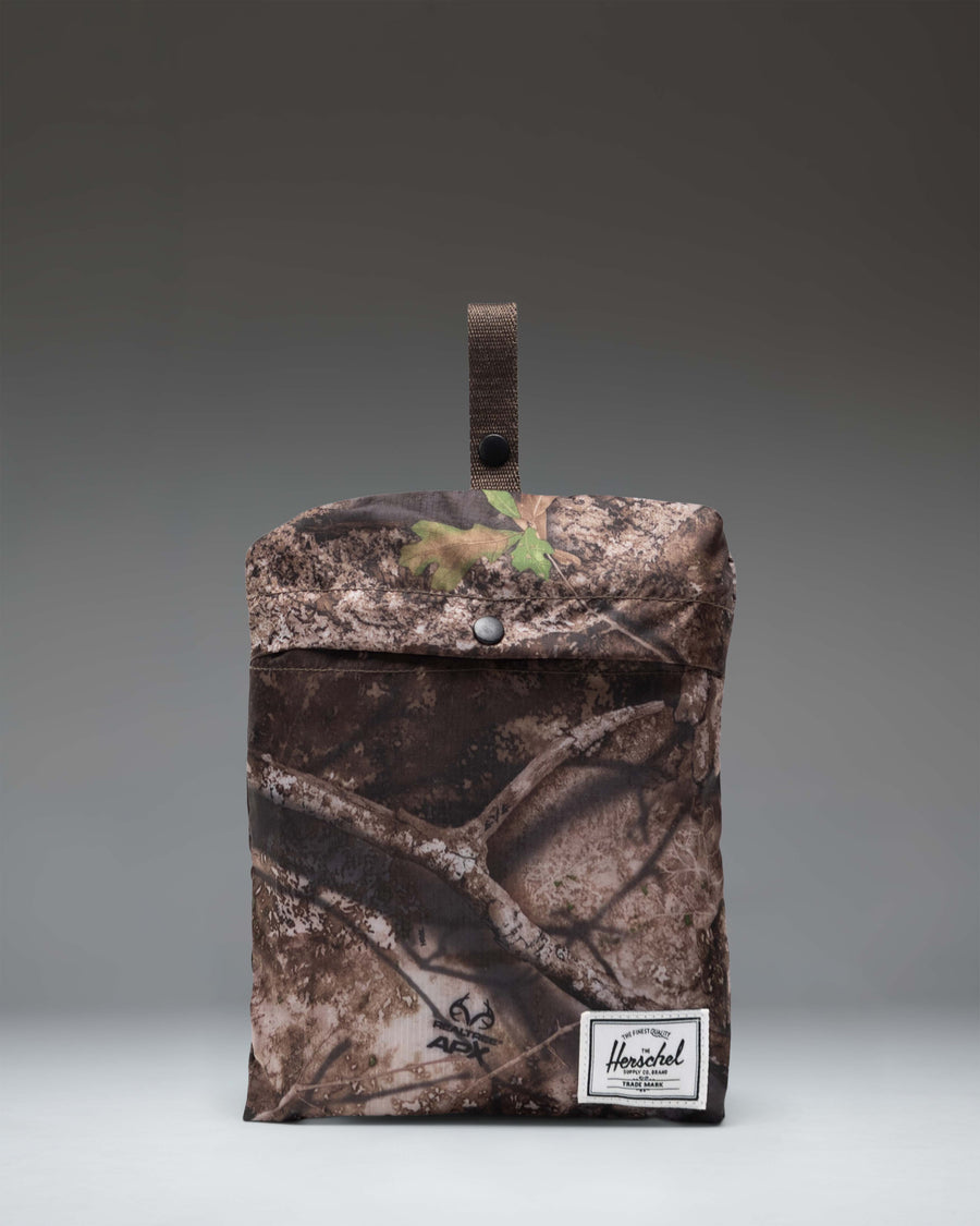 Herschel Supply Co. Realtree Portland Packable Tote in Realtree APX Camo, a lightweight tote bag perfect for travel or daily use.