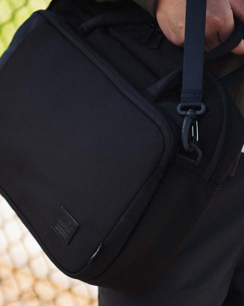 Herschel Supply Co. Gibson Messenger Tech Cordura bag in a variety of vibrant colors arranged neatly together.