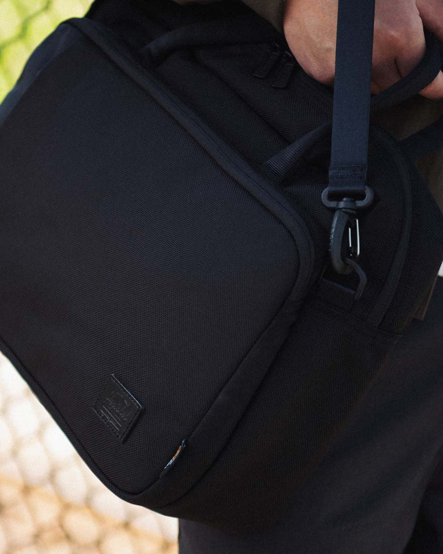 Herschel Supply Co. Gibson Messenger Tech Cordura bag in a variety of vibrant colors arranged neatly together.