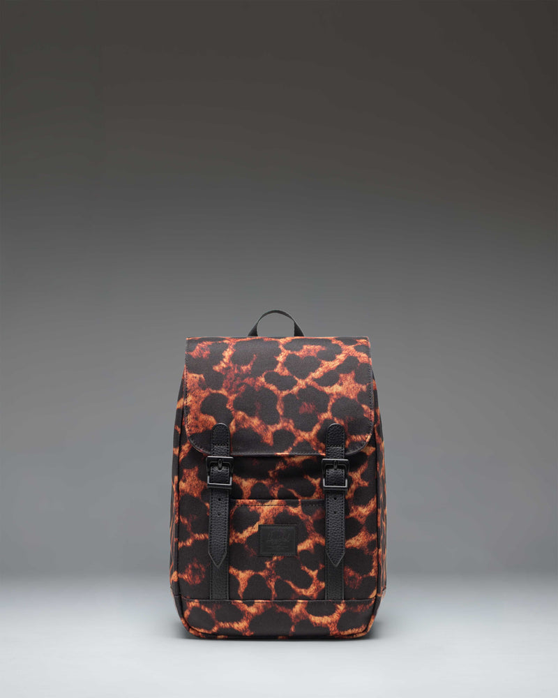 Herschel Retreat Mini Backpack in Digi Leopard print, featuring black rubber straps and a classic woven label.