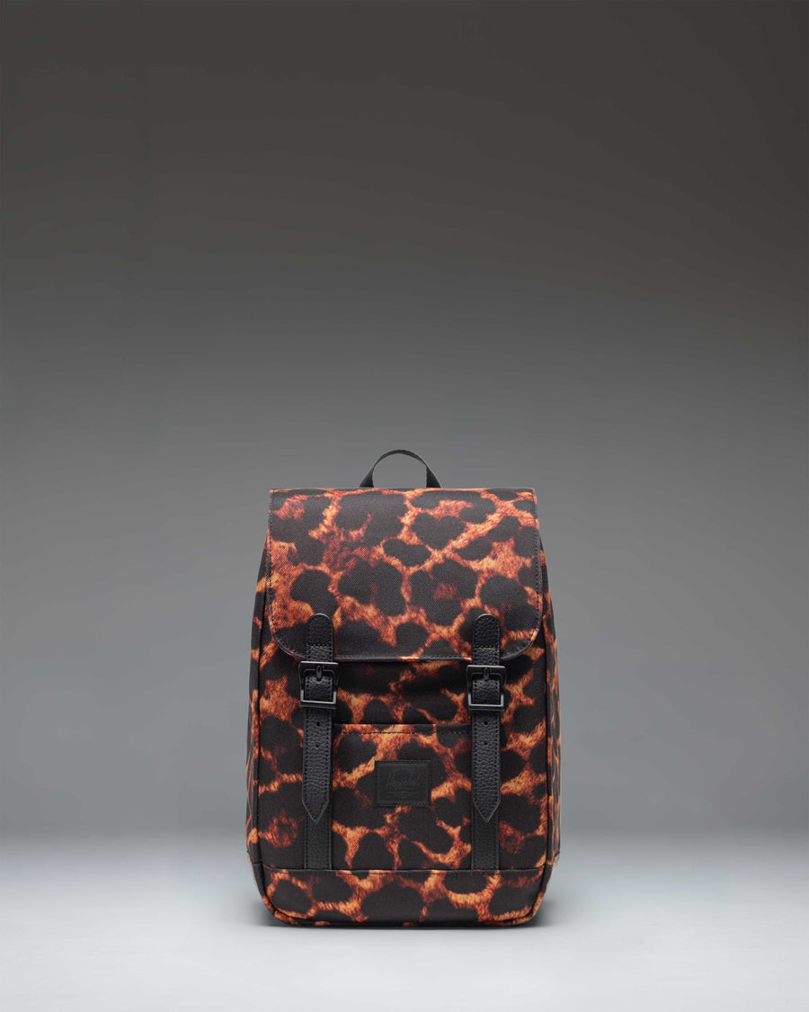 Herschel Retreat Mini Backpack in Digi Leopard print, featuring black rubber straps and a classic woven label.