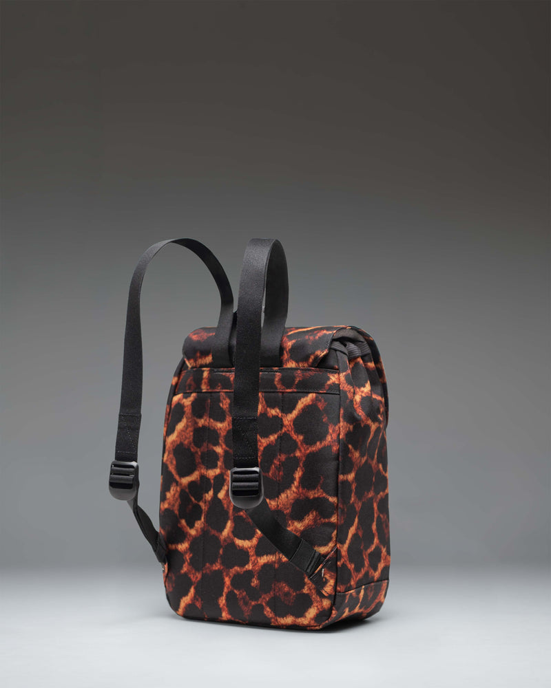 Herschel Retreat Mini Backpack in Digi Leopard print featuring a spotted leopard pattern with adjustable straps and front buckle closures.