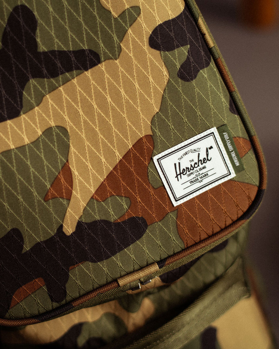 Herschel Watt Stand Bag golf bags displayed in Black, Navy, and Woodland Camo color options.