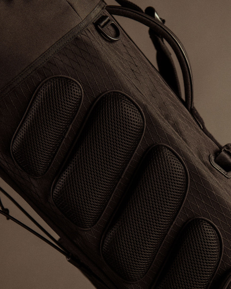 Herschel Watt Light Stand Golf Bag shown from multiple angles in black, navy, and woodland camo colorways.