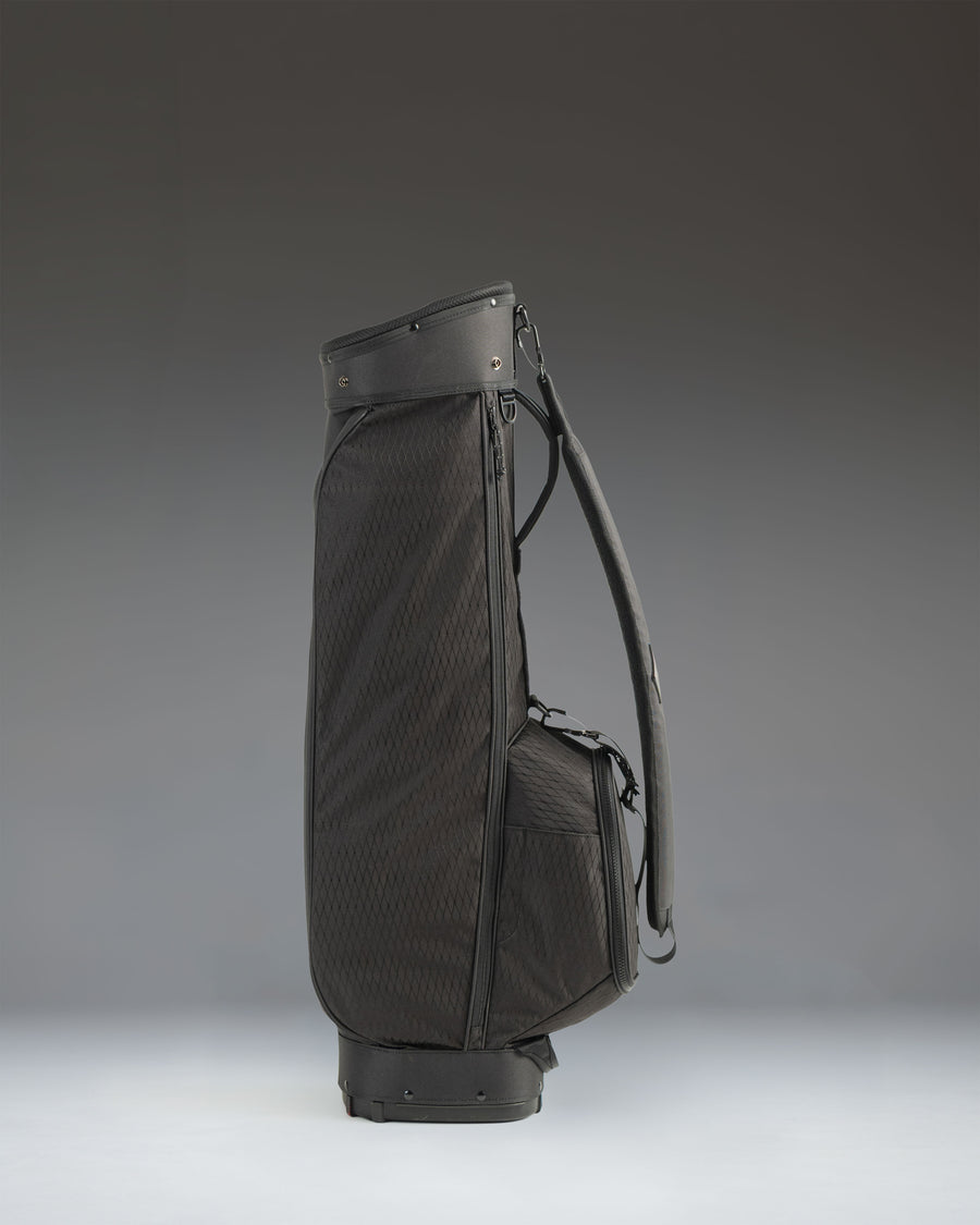 Herschel Supply Co. Herschel Watt Sunday Bag in black, featuring a sleek, minimalist golf bag design with carry straps.