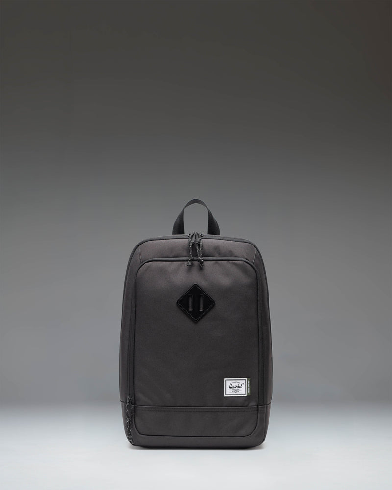 Black Herschel Heritage Shoe Bag showing the front view with a handle and the classic Herschel woven label.