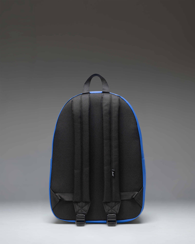Herschel Classic Backpack Twill in Dazzling Blue featuring a clean silhouette, front storage pocket, and adjustable straps.