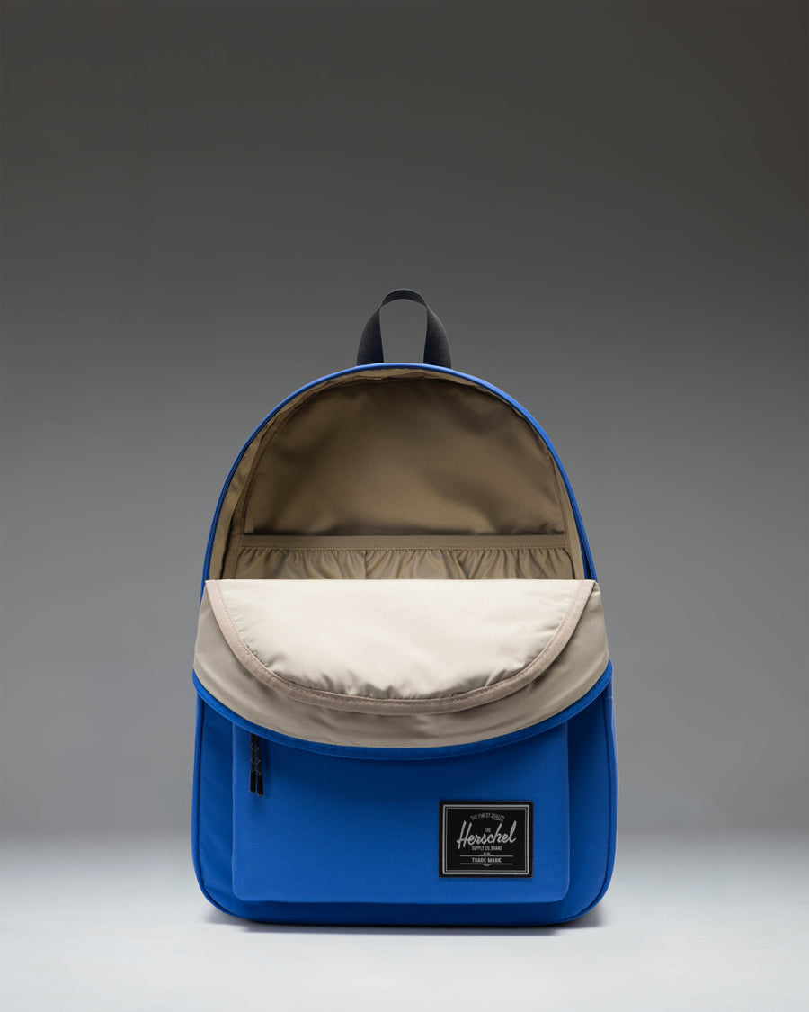 Herschel Classic XL Backpack Twill in Dazzling Blue, showcasing a vibrant blue color with a spacious main compartment and front pocket.