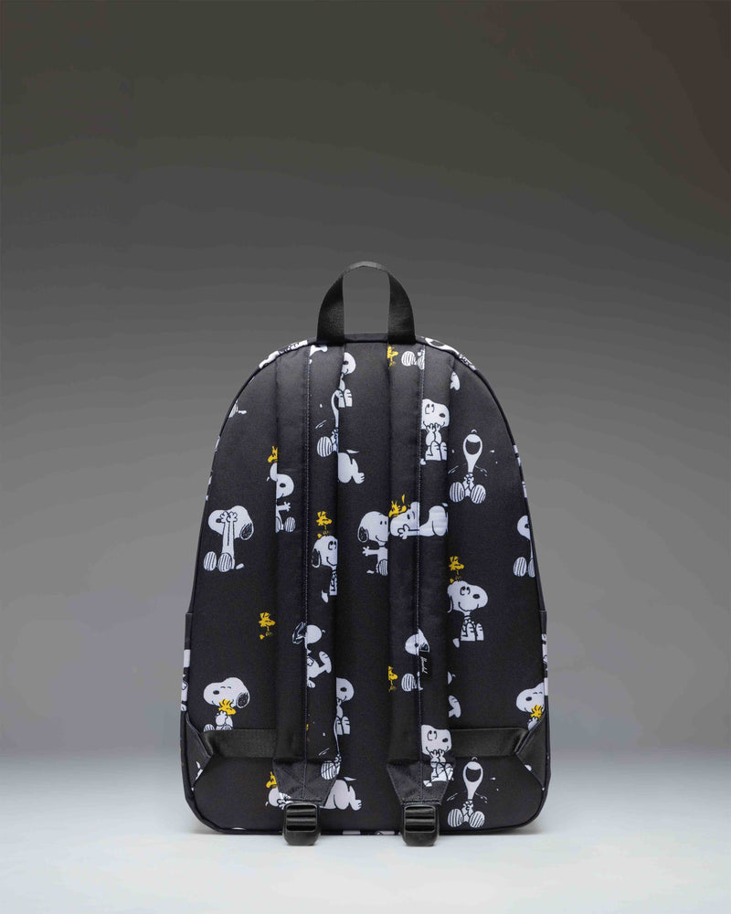 Herschel Classic XL Backpack in Snoopy and Woodstock Black pattern featuring characters printed on a black background.