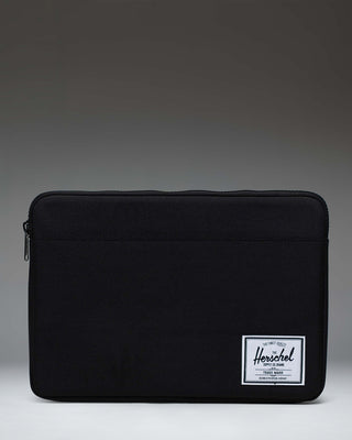 Herschel Supply Co Anchor 14 inch laptop sleeve in black, featuring a clean, minimalist design with a woven brand label.