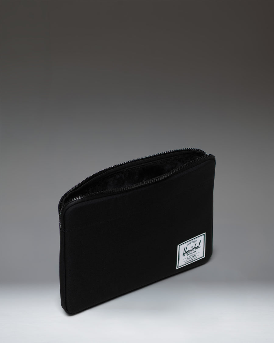 Herschel Supply Co. Anchor 14 Inch Sleeve in solid black, showing a clean and minimalistic protective tech sleeve.