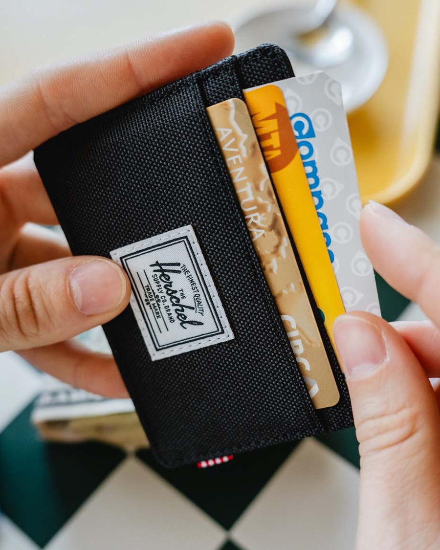 Herschel Supply Co Charlie Cardholder wallet showing multiple colors and designs laid out together.