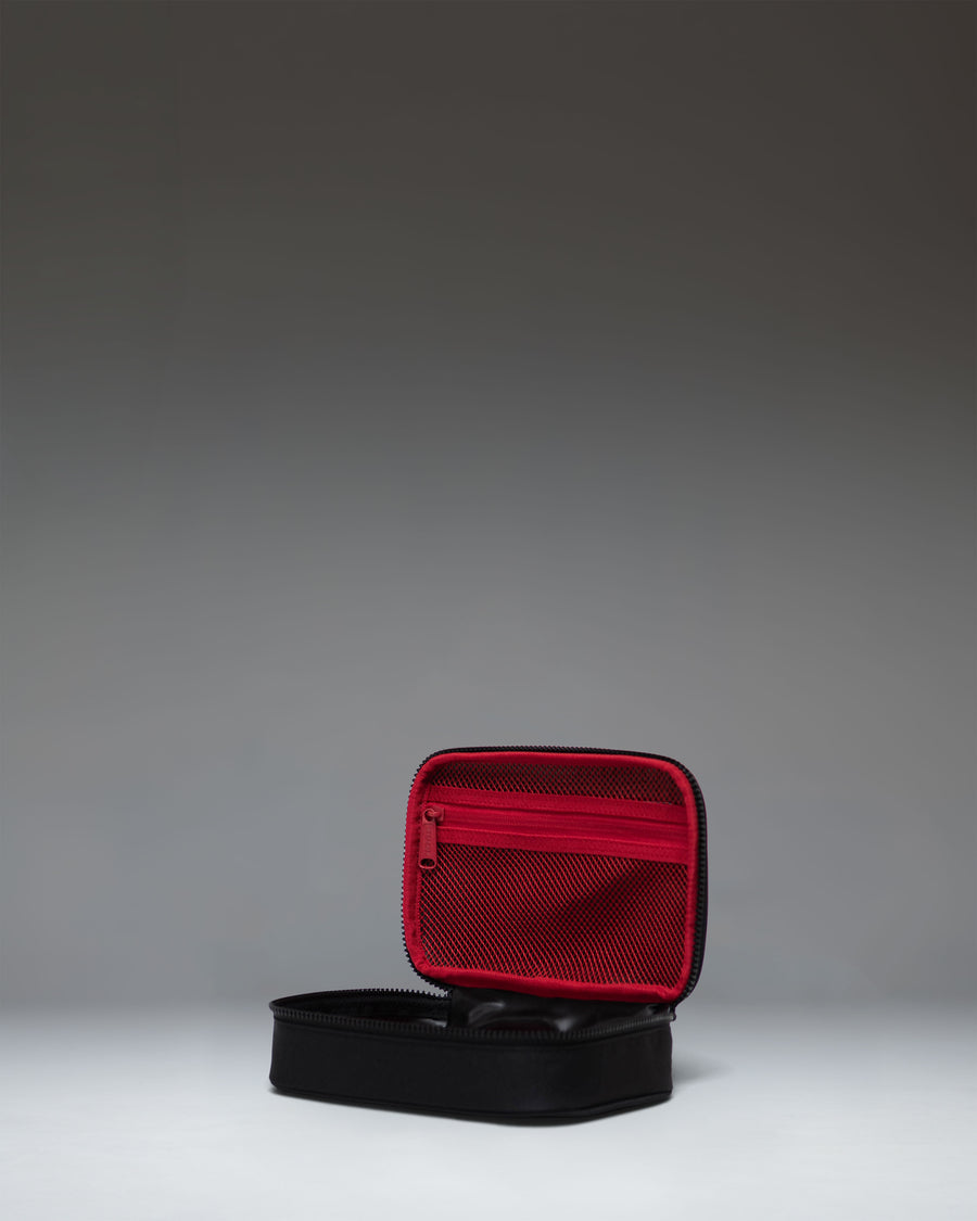 Black Herschel Heritage Pencil Case Little Herschel featuring a classic zippered design and the signature woven label.