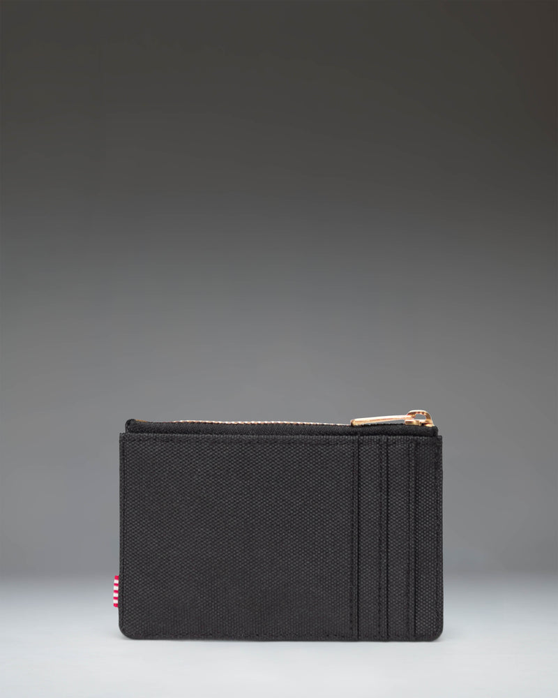 Black Herschel Supply Co Oscar Cardholder in Black, featuring multiple card slots and a compact design.