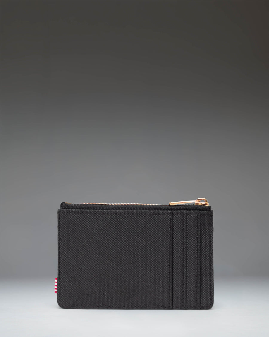 Black Herschel Supply Co Oscar Cardholder in Black, featuring multiple card slots and a compact design.