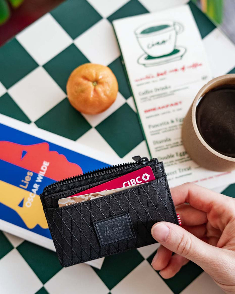 Herschel Supply Co. Oscar Cardholder displayed in a variety of available colors.