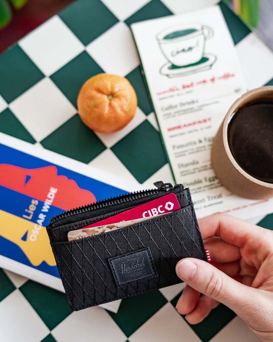 Herschel Supply Co. Oscar Cardholder displayed in a variety of available colors.