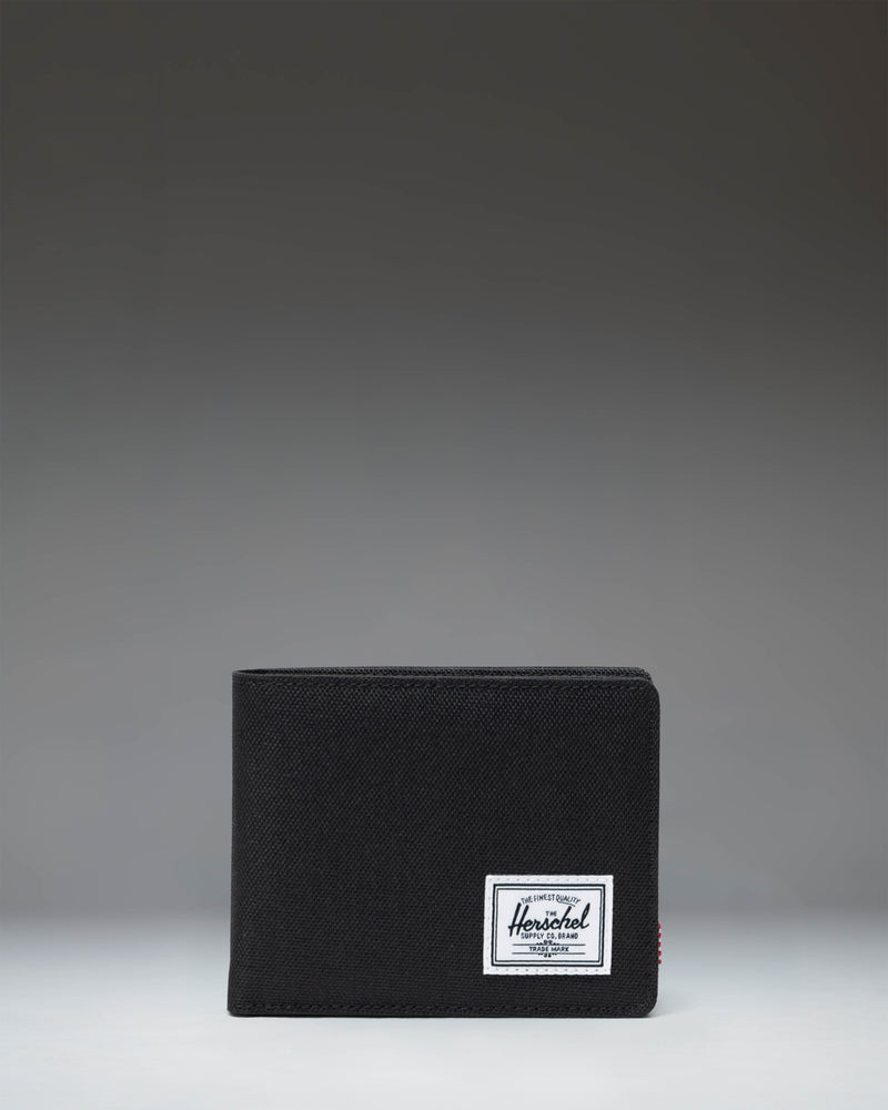 Black Herschel Supply Co. Roy Coin Wallet bi-fold design showing the clean front exterior with the classic woven label.