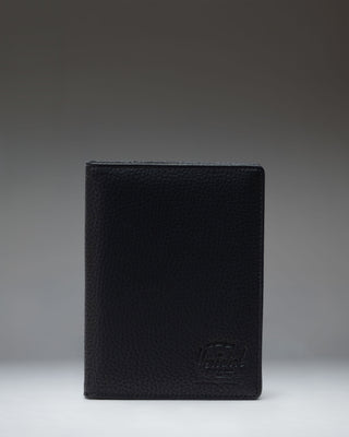 Black Herschel Supply Co. Raynor Passport Holder made from vegan leather.