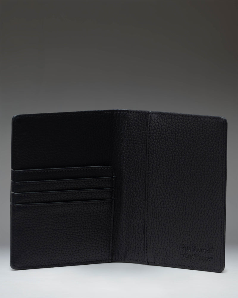 Herschel Supply Co Raynor Passport Holder in vegan leather black, showing the front exterior.