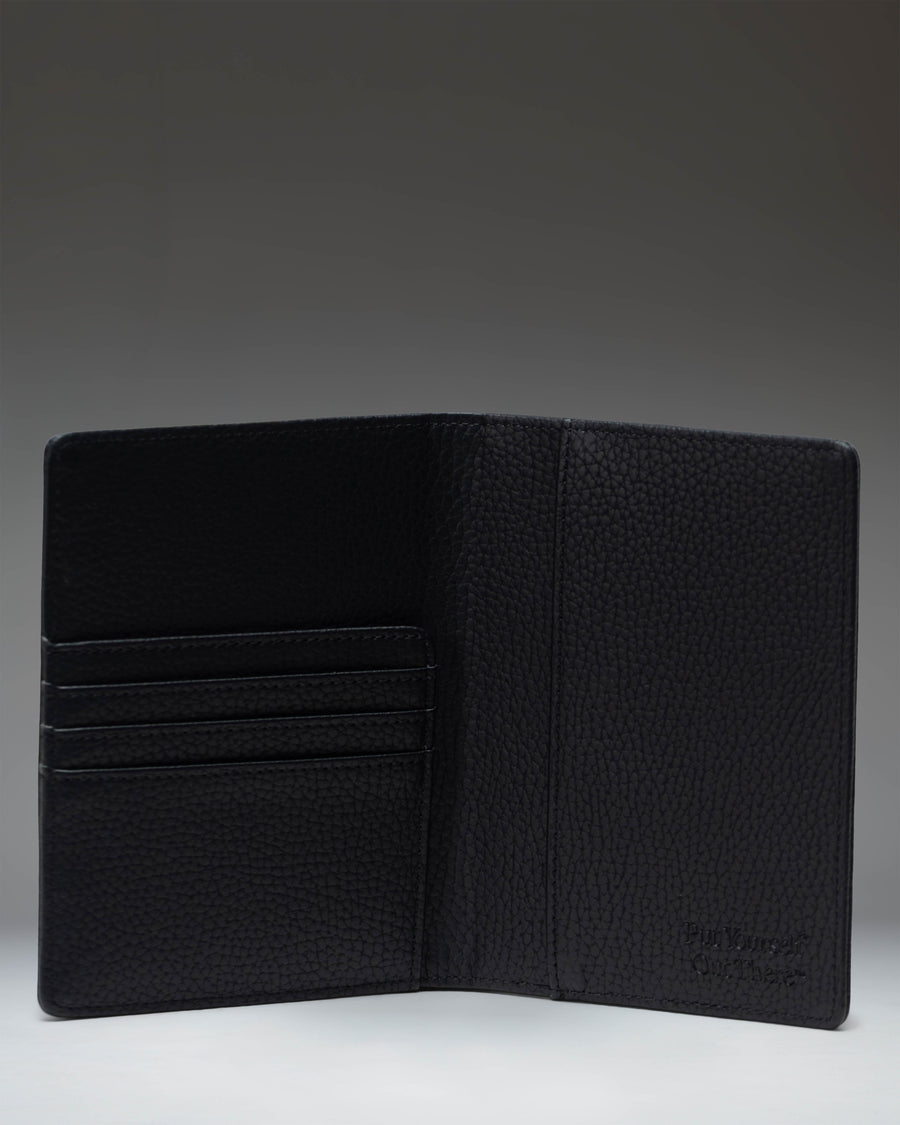 Herschel Supply Co Raynor Passport Holder in vegan leather black, showing the front exterior.