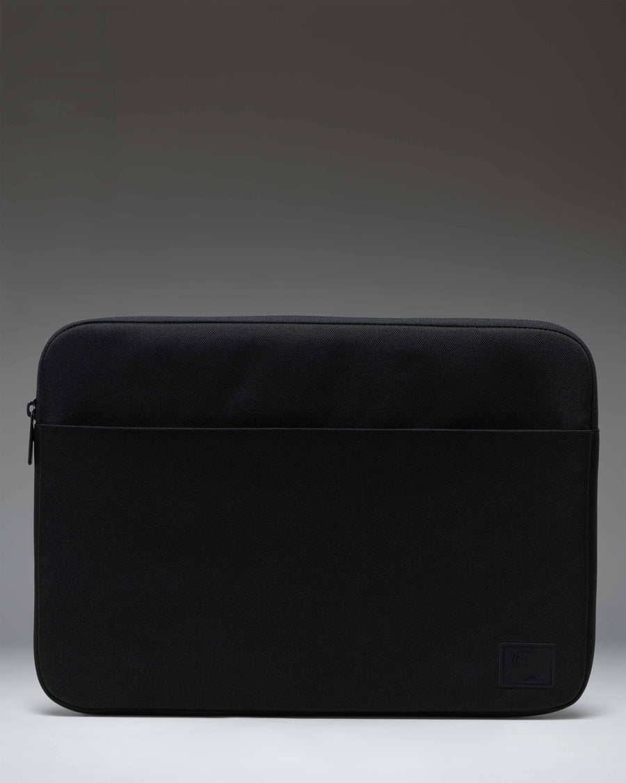 Herschel Supply Co. Denman 15-16 Inch Sleeve Tech in black, showing the sleek, minimalist laptop case design.