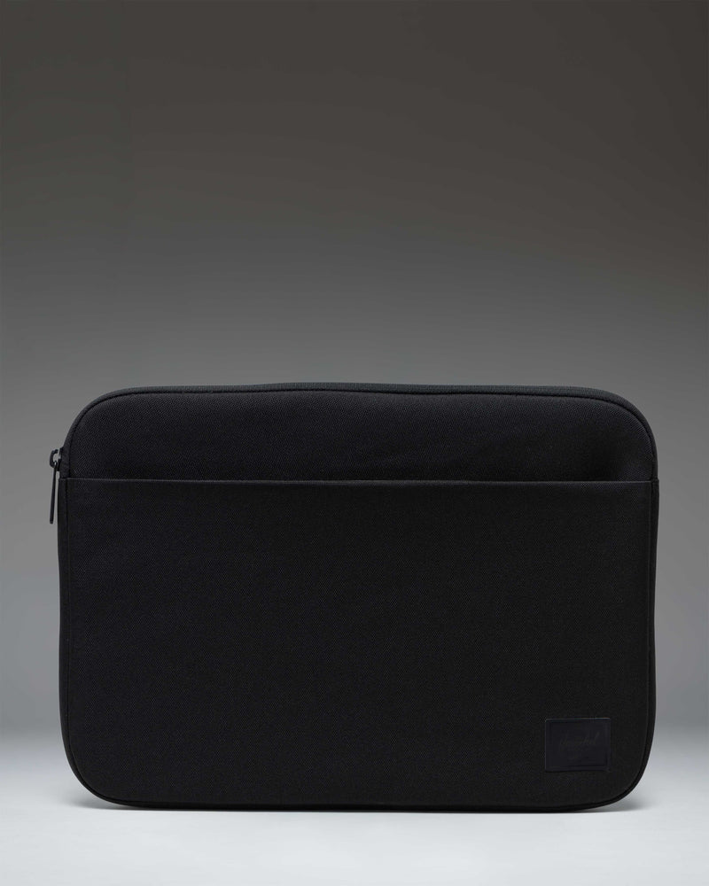 Black Herschel Supply Co. Denman 14-inch tech sleeve shown from the front against a white background.