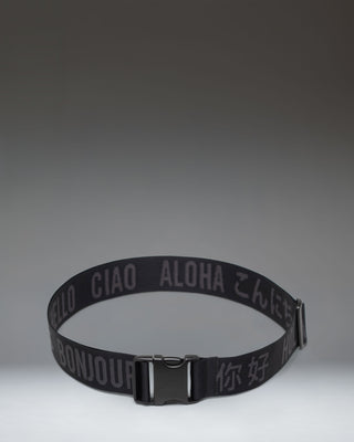Black adjustable Herschel Supply Co luggage belt with a quick-release buckle, designed to secure bags and suitcases.