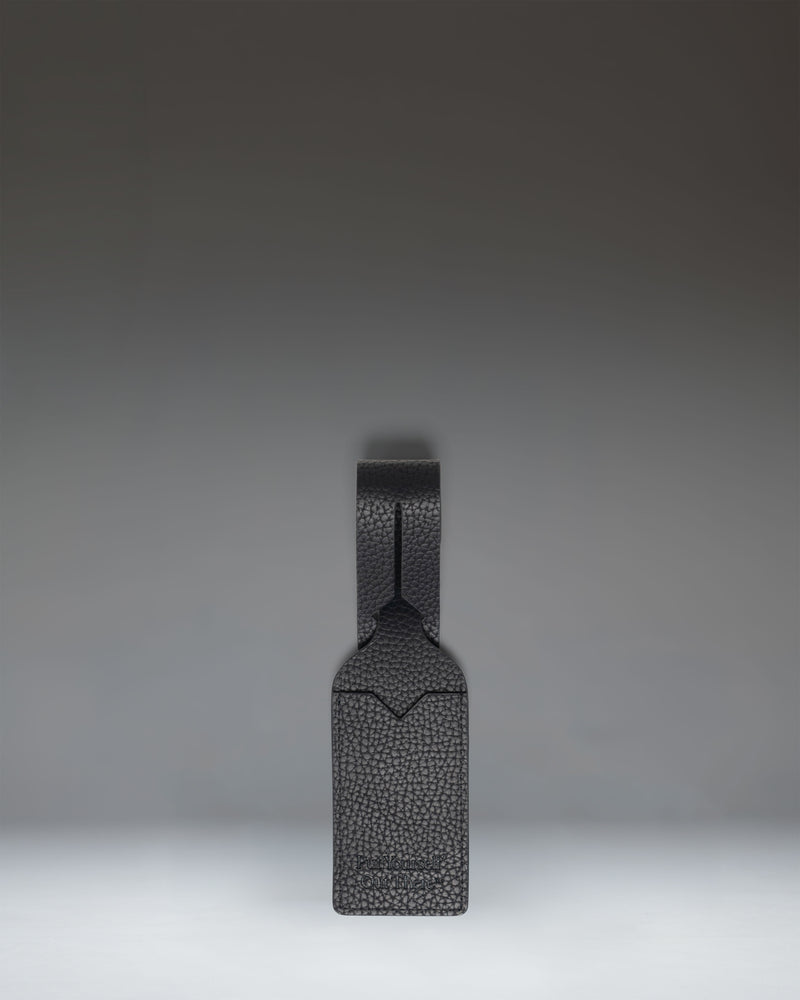 Herschel Supply Co. black vegan leather luggage tag.