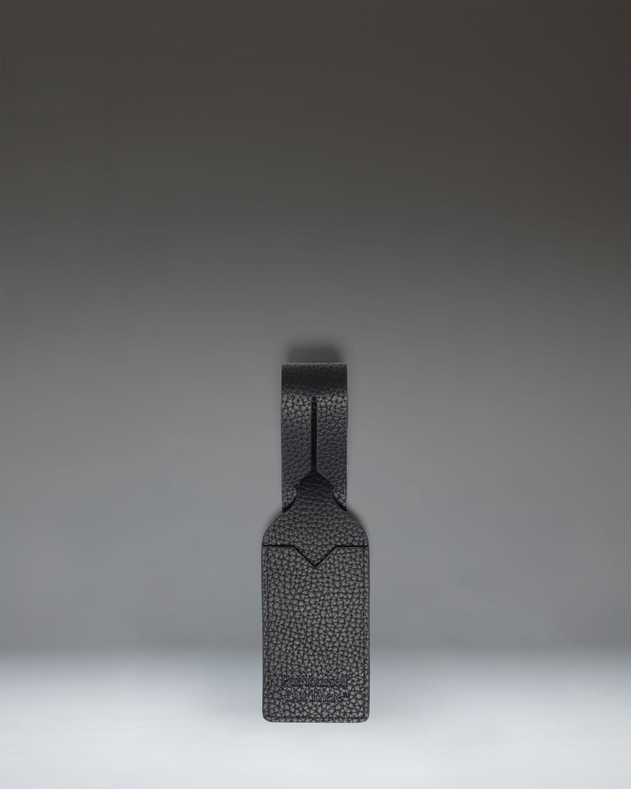 Herschel Supply Co. black vegan leather luggage tag.
