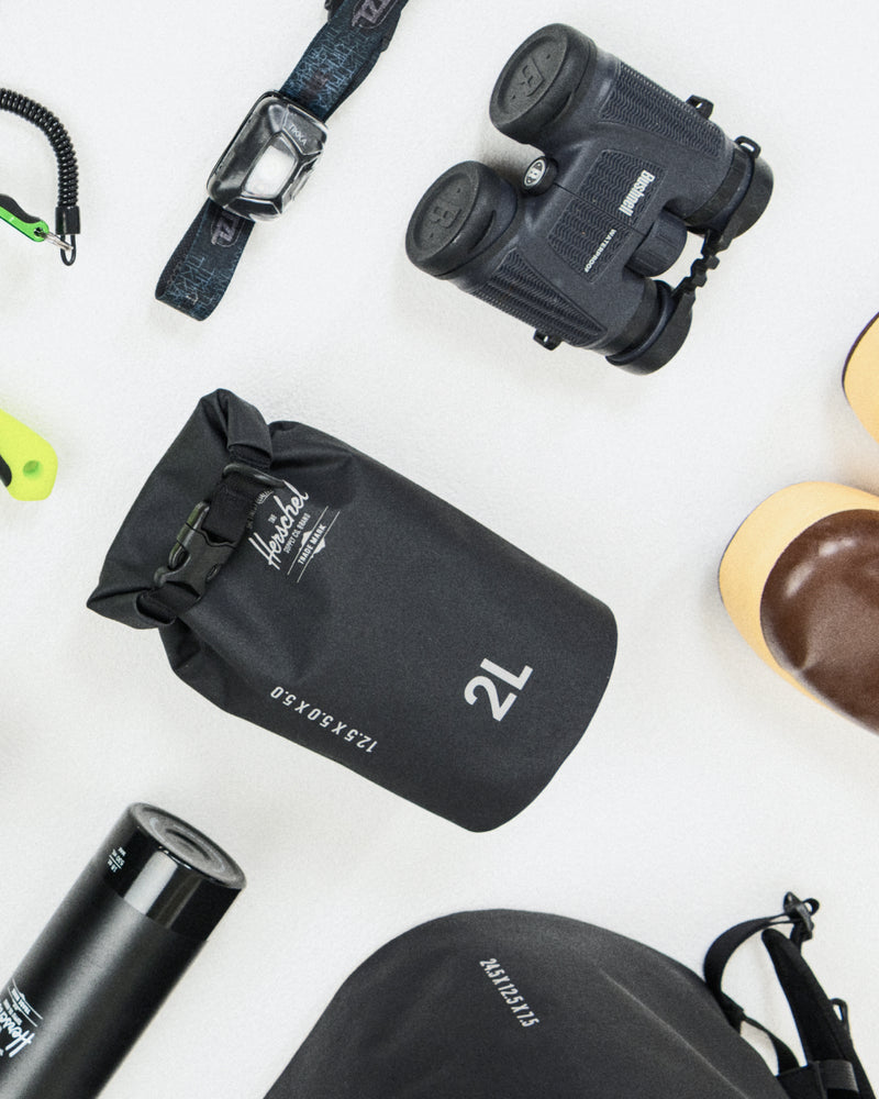 Herschel Supply Co. Dry Bag Organizer 2L waterproof bag size guide chart showing open and closed dimensions.