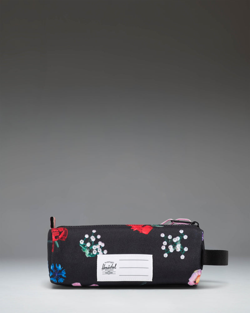 Herschel Supply Co. Falling Florals LEGO Settlement Pencil Case for kids, featuring a black floral pattern and a classic brick accent.