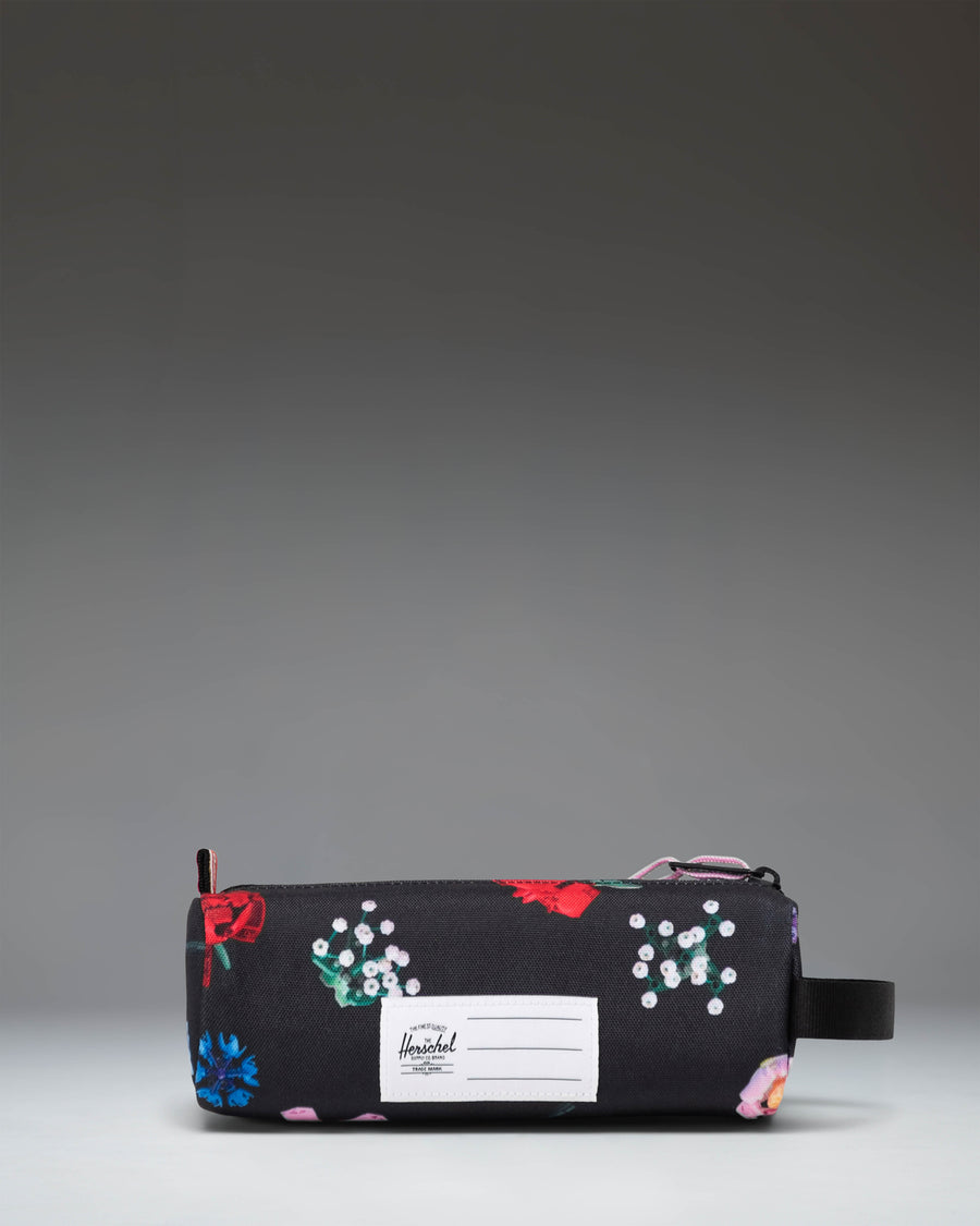 Herschel Supply Co. Falling Florals LEGO Settlement Pencil Case for kids, featuring a black floral pattern and a classic brick accent.
