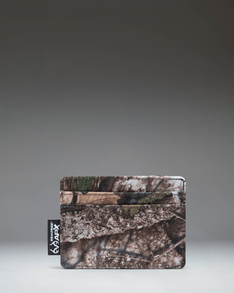 Herschel Supply Co. Charlie cardholder wallet in Realtree APX Camo pattern.