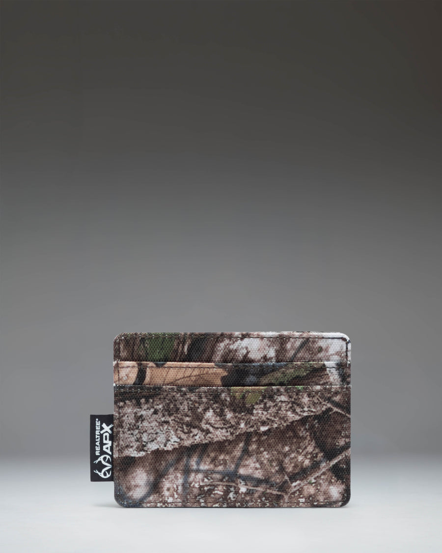 Herschel Supply Co. Charlie cardholder wallet in Realtree APX Camo pattern.