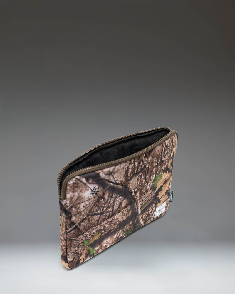 Herschel Supply Co. Realtree Anchor 14 Inch Sleeve in Realtree APX Camo.